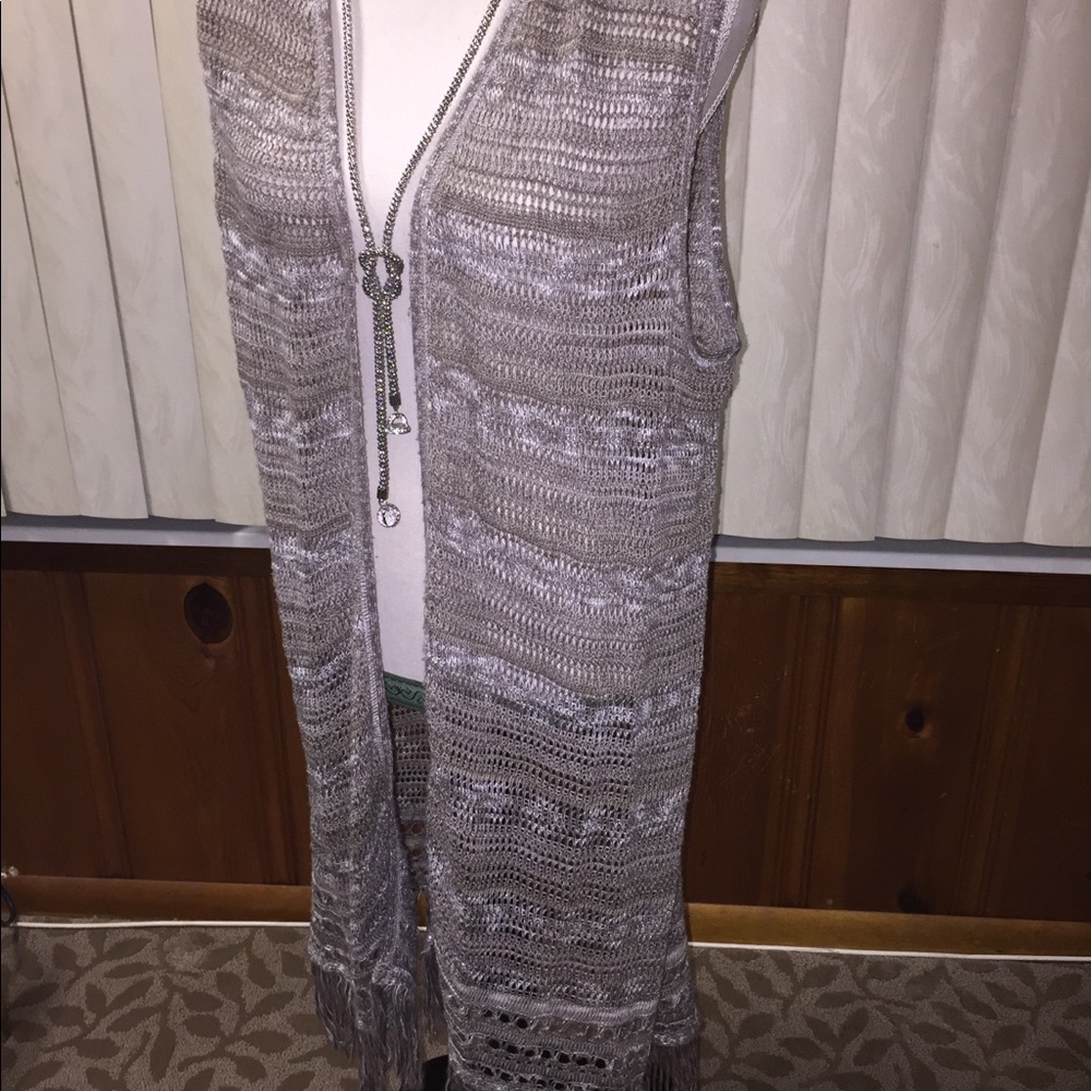 Long sleeveless earth colored cardigan